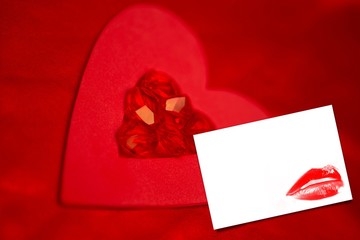Composite image of rubies and paper red heart