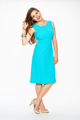 Woman fashion model in blue cocktail dress.