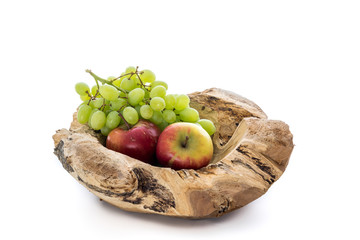 Wooden bowl with apples and grapes