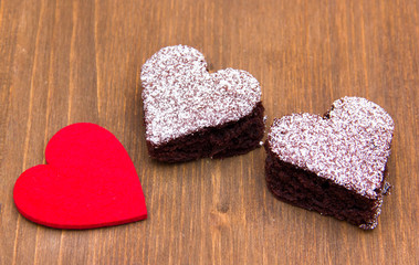 Fototapeta na wymiar Pastry heart-shaped chocolate on wooden table