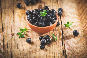 Blueberries in a bowl on a beautiful rustic table