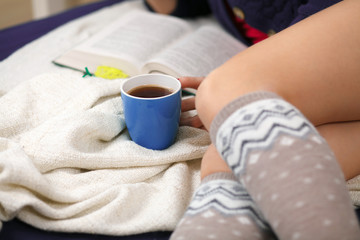 Female legs in warm woolen socks