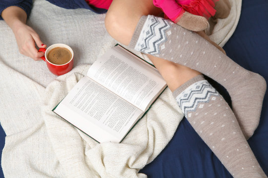Female legs in warm woolen socks