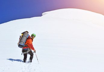 Climber on snowy summit