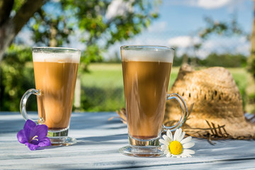 Coffee latte in a sunny garden