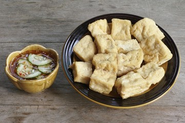 Fried Tofu, Bean Curd serve on wood table