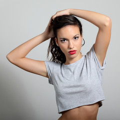 Fototapeta premium Indoor fashion portrait of beautiful young woman