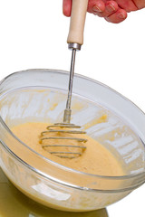 Hand whisk batter in the bowl