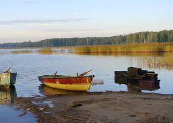 Lake with boats on shore