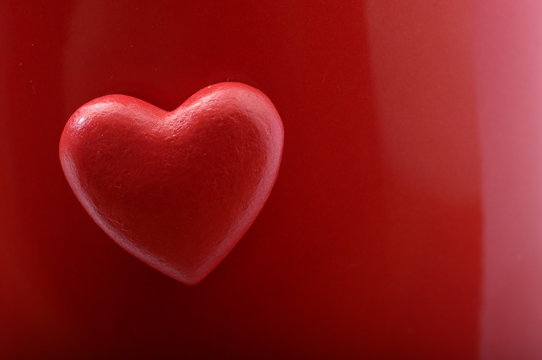 Red heart on red background