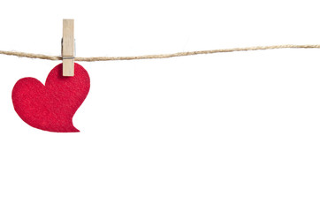 Red fabric hearts hanging on the clothesline . On white backgrou