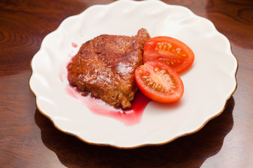 Dish with fried meat and sauce