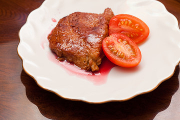 Dish with fried meat and sauce