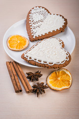 Fototapeta na wymiar White heart shape gingerbread cookies on plate