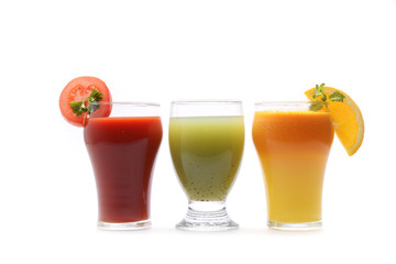 Fresh fruit and vegetable juices on white background
