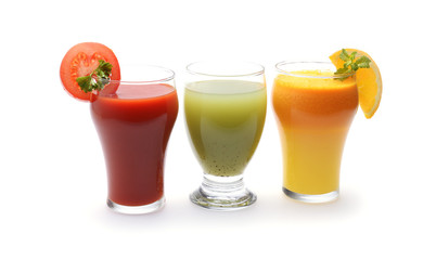 Fresh fruit and vegetable juices on white background