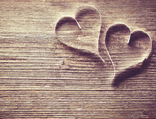 Wooden background with hearts