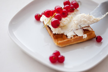 Plate of belgian waffles with cream cheese