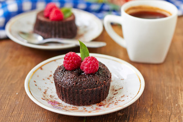 Chocolate muffins with raspberries for breakfast