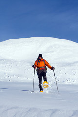 Winter hiking in snowshoes.