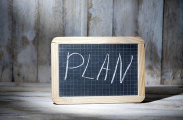 Checkered board with the plan text