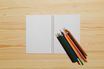 Color pencils on wood background