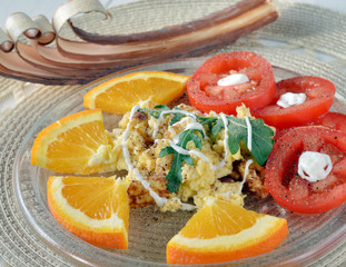 Omelette with oranges and tomatto for the Lunch