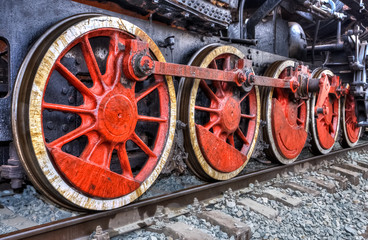 Fototapeta na wymiar Old steam locomotive engine wheel and rods details