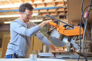 A Carpenter working hard at the shop