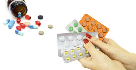 Different tablets in hands and on a white background