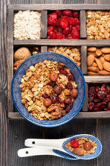 Granola muesli, nuts, dried berries . Top view.