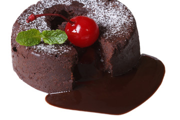 chocolate fondant with cherries and mint closeup isolated