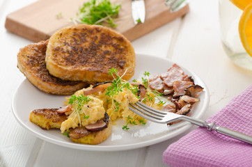 Scrambled eggs with French toast topped with watercress