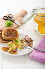 Scrambled eggs with French toast topped with watercress