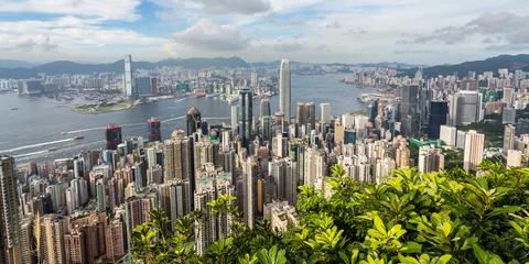 Foto op Plexiglas De skyline van Hong Kong vanaf The Peak © AlexQ