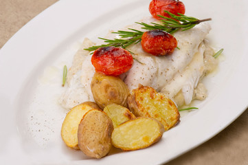 Fish dish - fish fillet in sauce and vegetables