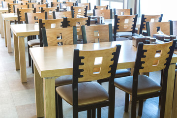 Restaurant interior with wooden table and chair