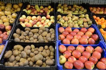 trays of fruit and vegetables in the store