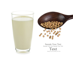 soybeans on wooden spoon and soy milk isolated on white