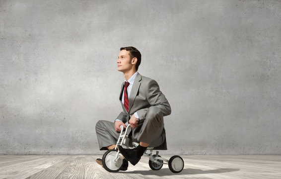 Business man riding bike