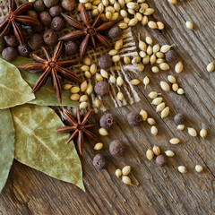 Various spices closeup on wooden surface