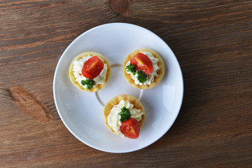 tartlet with cream, tomato and dill