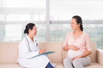 Pregnant woman having consultation