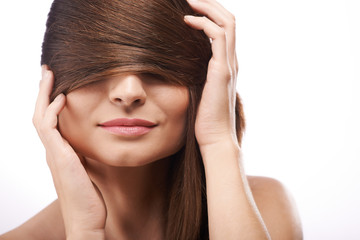 Fototapeta premium Covering eyes with hair