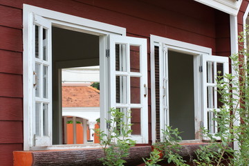 white wood window on wooden house