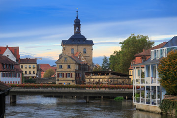Fototapeta na wymiar Bridges, Altes Rathaus and cloudy sky in Bamberg