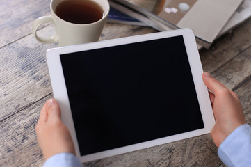Digital tablet computer with isolated screen in female hands