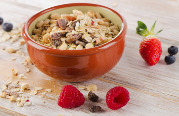 muesli breakfast in clay bowl