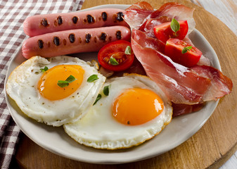 breakfast with fried eggs,bacon, toasts