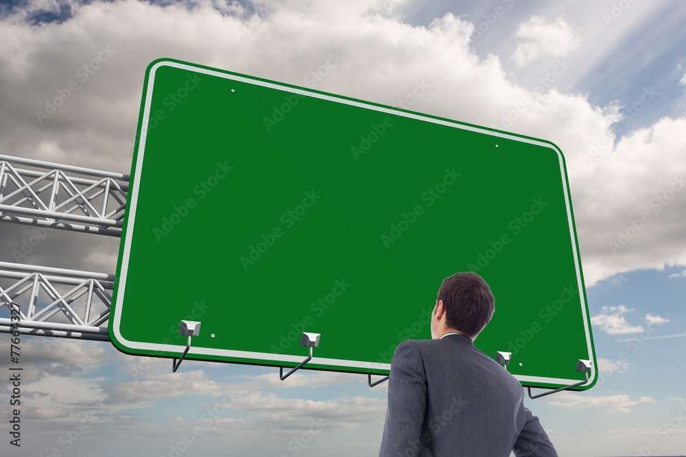 Poster composite image of businessman standing with hand on hip